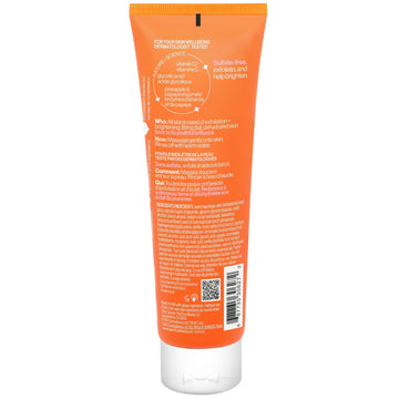 The back of an orange squeeze tube of skincare product, showing detailed text, a barcode, and a QR code on a plain white background.