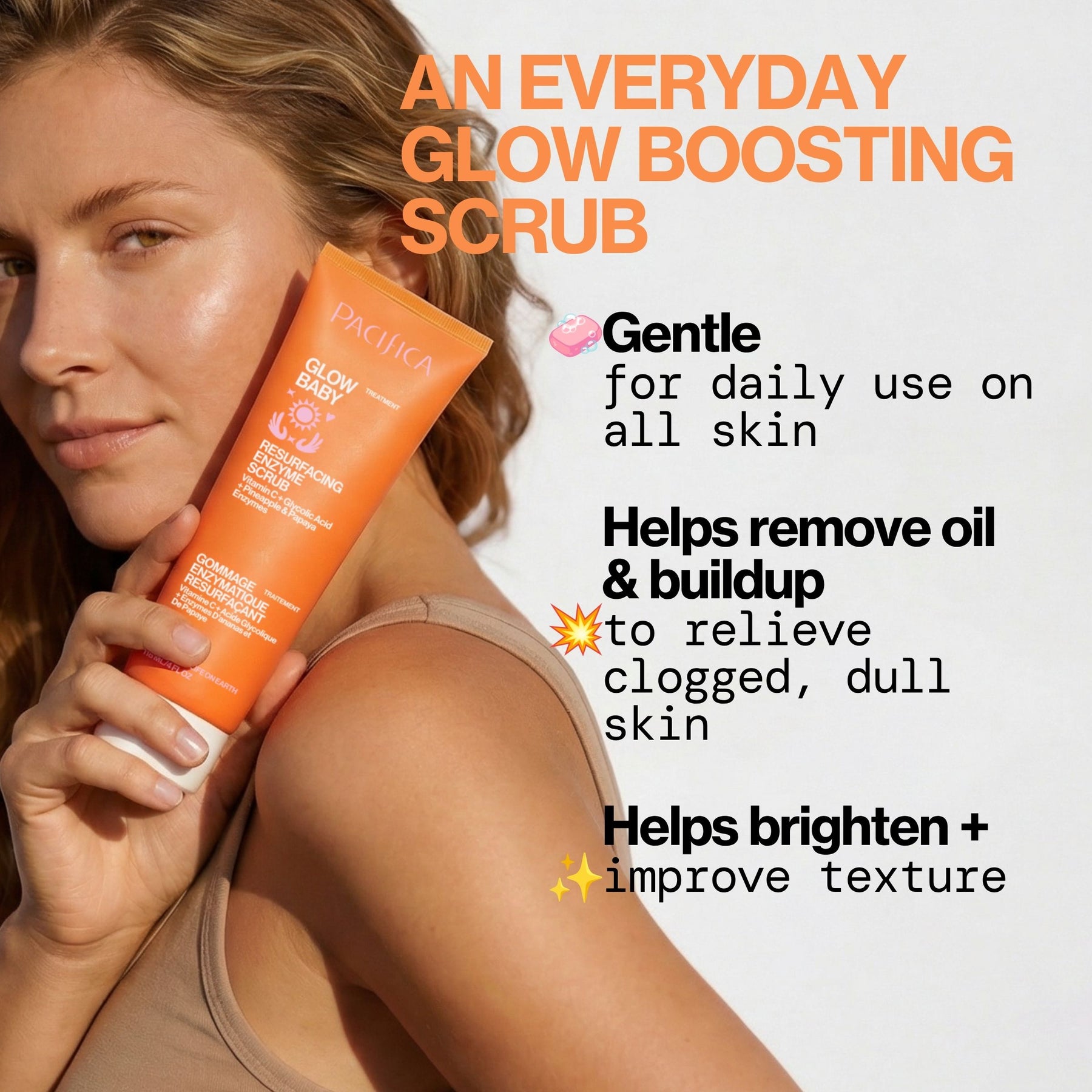 A woman holds an orange Pacifica Glow Boosting Scrub tube against a light background with promotional text describing the daily glow-boosting scrub benefits.